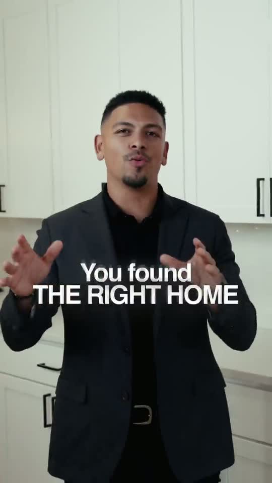 Isaac Ortiz standing in a white kitchen talking to camera