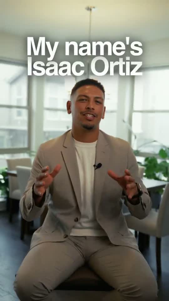 Isaac Ortiz seated in a bright dining room, mid-sentence